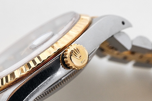The bezel and crown of a Rolex Datejust