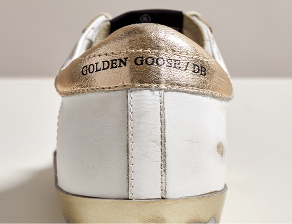 Golden Goose Sneakers brand stamp on counter