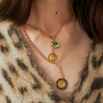 Person wearing Foundrae necklaces