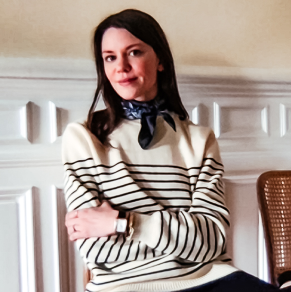 Marie Claire Accessories Director Julia Gall wears a striped sweater, neck scarf and watch