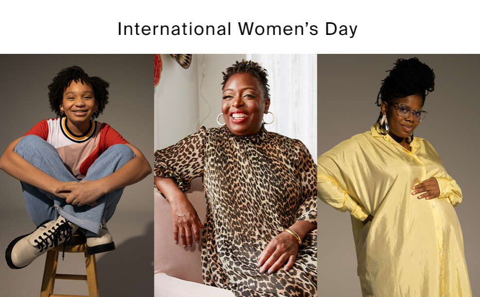 International Women's Day 2021: Black Girls Code student, Jordyn in a printed t-shirt and denim jeans. Founder & CEO Kimberly Bryant in a leopard animal print dress, gold hoop earrings and a gold bracelet. Volunteer Samantha Broxton in a yellow shirt dress, glasses and oversized gold earrings